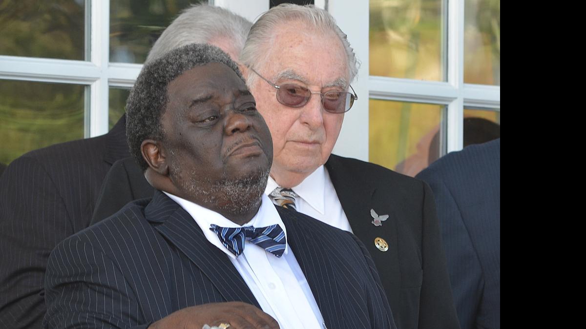 Bennie Swans Jr., left, and John Bonsignor, co-chairs of the Alert Community Coalition wait their turn to speak at Pine Lakes Country Club.