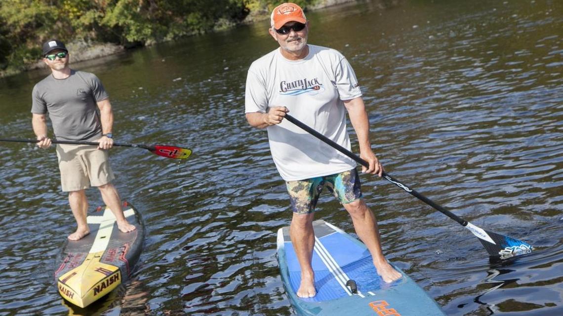 Mark Allison (right) with Terry Smith demonstrate the growing sport of paddle boarding on the Intracoastal Waterway on Tuesday, Nov. 1, 2016. Allison recovered from a heart attack in June to compete with friends in the Chattajack 31, a grueling 31 mile race through the Tennessee River Gorge.