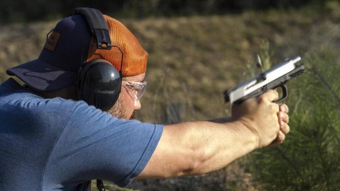 Tyler Murtha shoots a pistol at the Horry Chapter Wildlife Action range outside of Aynor.