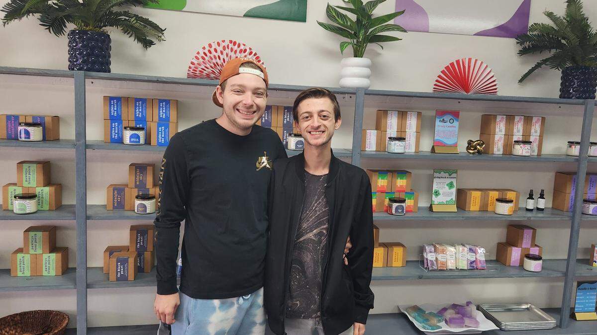 Landon Schultz-Zwahr, left, and his partner Chase Masters opened their first Lucid Coast Candle Company brick-and-mortar location in downtown Myrtle Beach on Jan. 11, 2023.