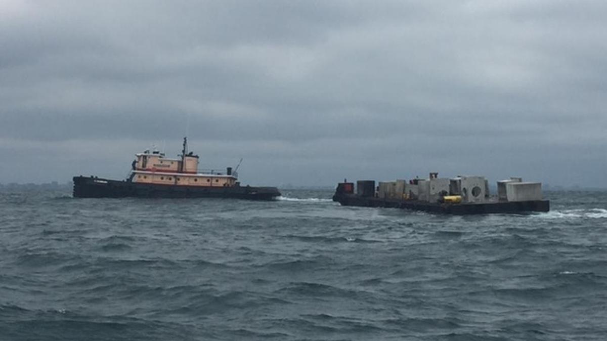 A load of concrete junction boxes arrives at new reef site PA 07, the Pop Nash Reef, on Wednesday. The reef is located nine miles north-northeast of Murrells Inlet.