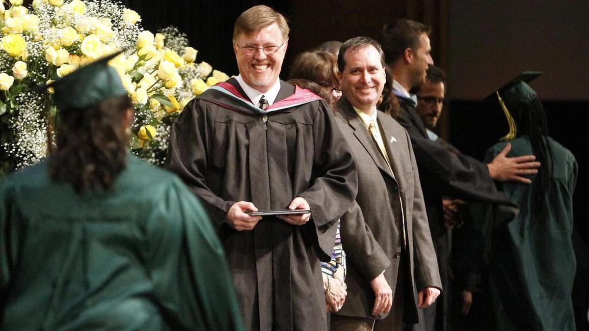 Myrtle Beach High School Principal John Washburn is at the front of the line to present diplomas in the commencement ceremony at Myrtle Beach High School on Wednesday, June 3, 2015.