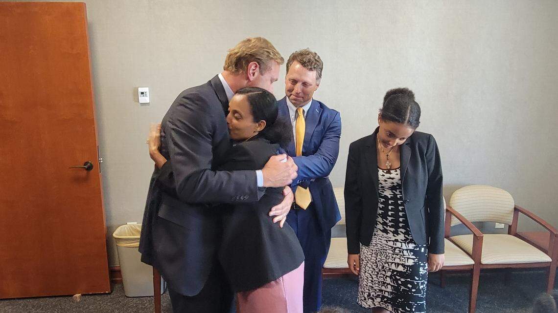 Attorney Mullins McLeod embraces Meswaet Abel on July 29, 2022 at the Horry County Courthouse following a civil trial where her family was awarded more than $20 million after the 2018 drowning death of her fiancee, Zerihun Wolde.