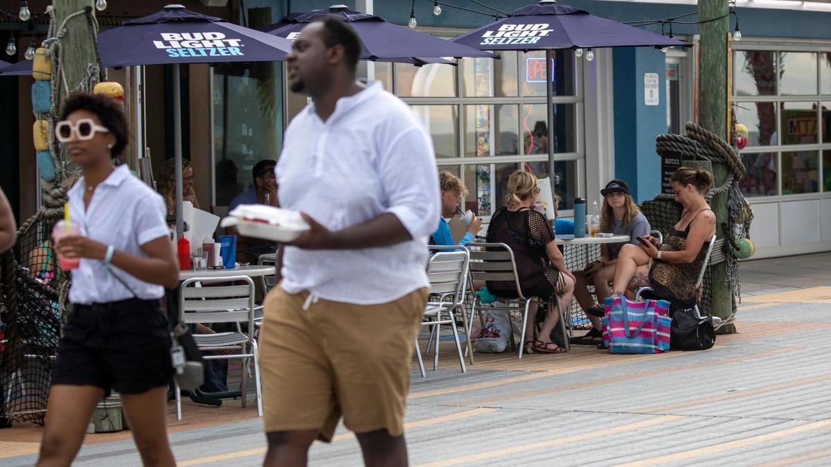 The Myrtle Beach Boardwalk is lined with outdoor seating for the many restaurants, cafe’s and bars. July 12, 2022.