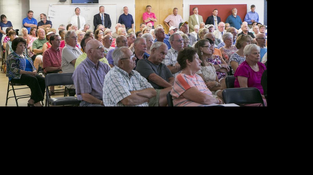 
County and state officials line the back wall of a meeting of the Carolina Forest Civic Association to discuss the RIDE 3 plan and their concerns with the current state of the roads in the area.
