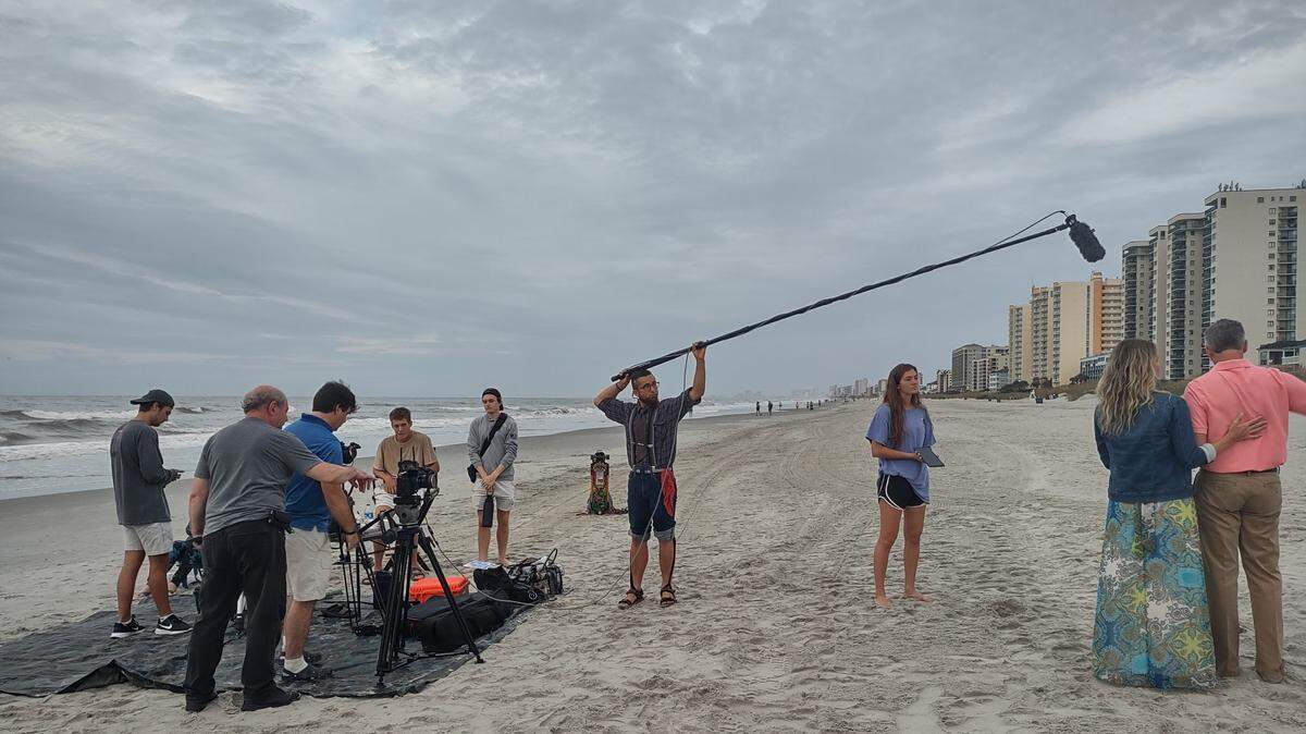Camera crews film beach scenes from the feature film, “My name is Melissa,” which comes out in early 2023.