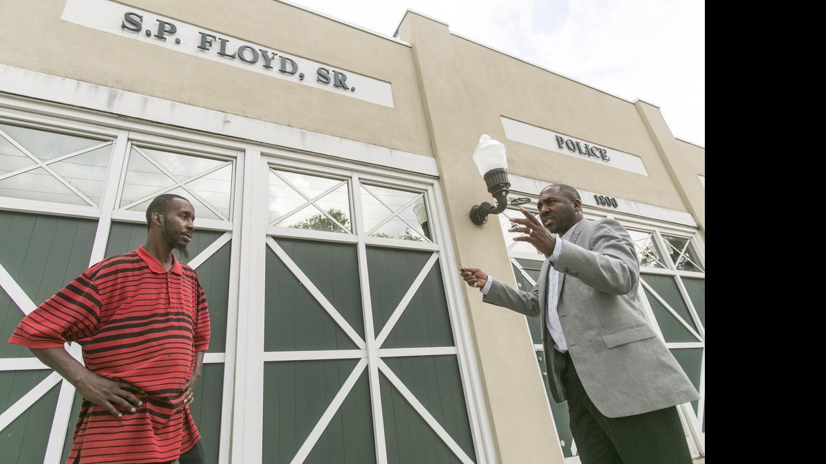 
Wallace Evans Jr, Executive Director of A Fathers Place (right), talks to Tyron Bryant who says he plans to use the new facilities. The organization will be moving into the former Police Substation on Racepath Drive in Conway.
