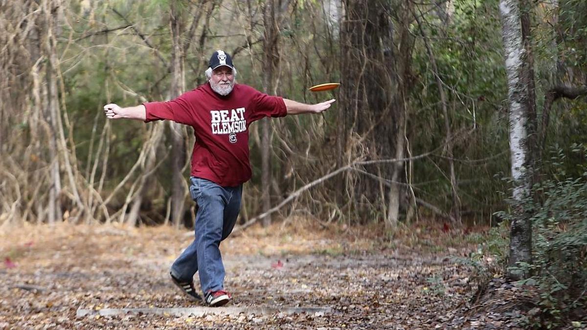Tom Housner plays on the the 18-hole disc golf course he helped build at the Socastee Recreation Park on Thursday, Dec. 3, 2015. The recreation park, located off Butler Road, has ball fields, a race track, an archery club area, a nature trail, a playground and the disc golf course.