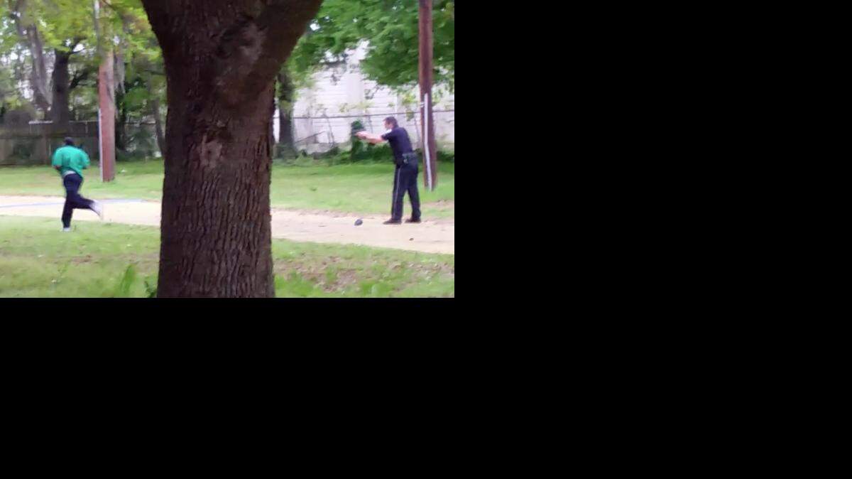 
Video, provided by Attorney L. Chris Stewart representing the family of Walter Lamer Scott, shows Scott running away from city patrolman Michael Thomas Slager, right, in North Charleston, S.C. Slager was charged with murder on Tuesday, April 7, hours after law enforcement officials viewed the dramatic video that appears to show him shooting a fleeing Scott several times in the back. (AP Photo/Courtesy of L. Chris Stewart)

