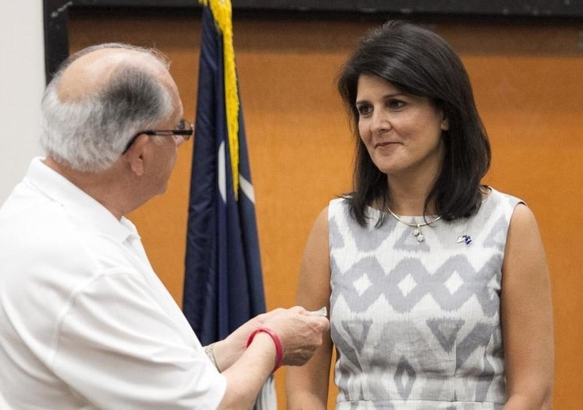 Gov. Nikki Haley talked about the outcome of Memorial Day Bikefest following a Hurricane preparedness meeting with local officials. Mayor John Rhodes gives a Myrtle Beach City Coin to Governor for Gov. Nikki Haley as thanks for the state’s support with Bikefest.