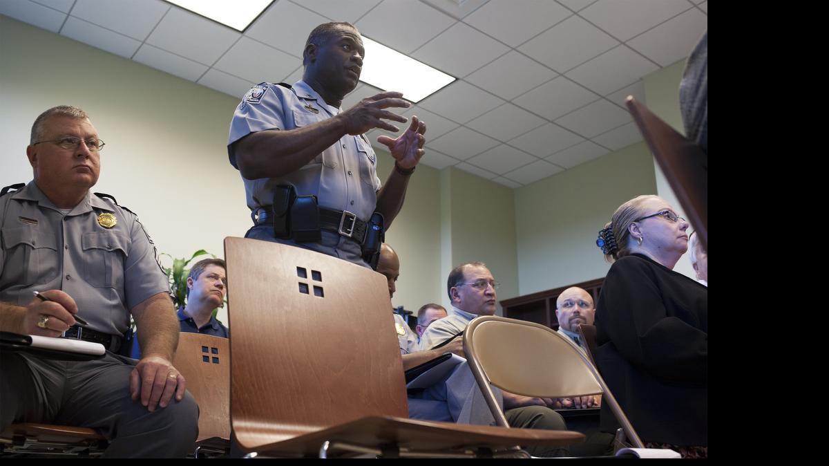 
Captain Joe Nell, center, of the South Carolina Highway Patrol, talks during one of several task force meetings in the past year making plans for Memorial Day weekend. 
