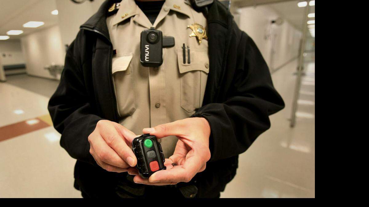 
Shelby County Sheriff's Department SRO Joseph Fox displays the departments new body cameras that officers are now wearing. 
