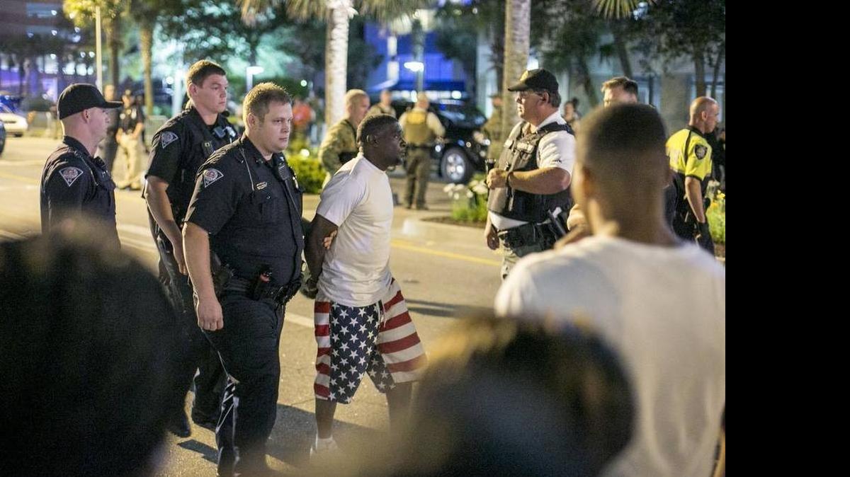 
A man is taken for questioning after a shooting at Compass Cove Resort during Atlantic Beach Bikefest in 2015.
