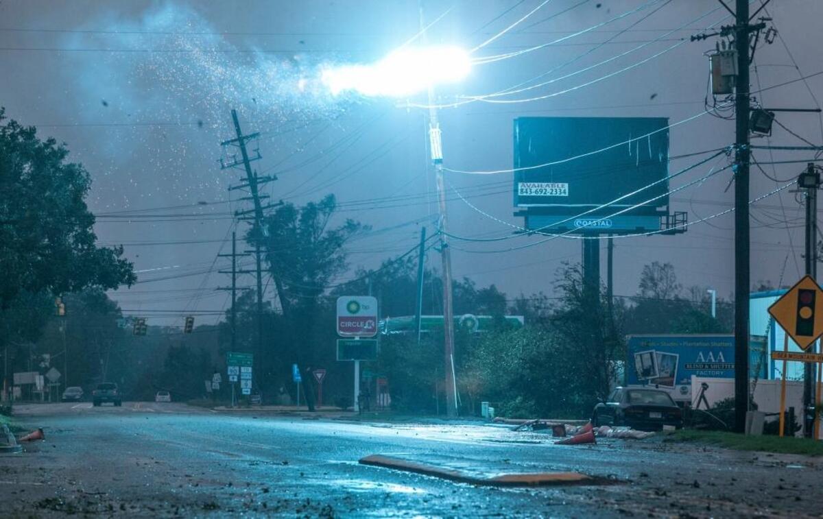 A vehicle was tangled in a downed power line which caused sparks to fly at Nixon's Crossroads on U.S. Hwy 90. Saturday, Oct. 8, 2016.
