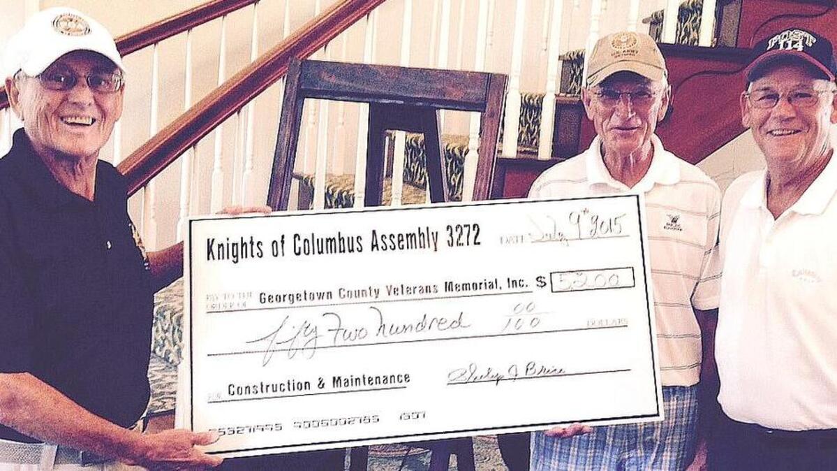 
Tom Bowen (from left) presents a check to Ron Gilbert and Rodney Ward.

