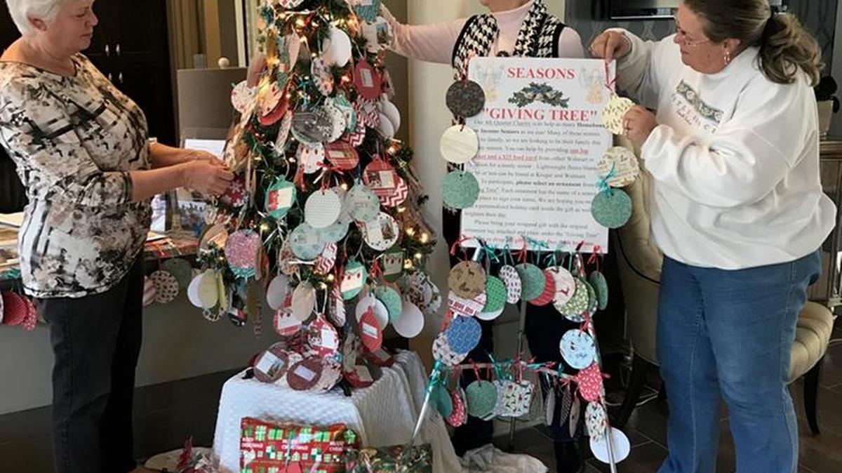Mary Mahoney, Gail Gilberto and Sherry Fannin decorate the Christmas tree at the Seasons community for seniors receiving home delivered meals from the Horry County Council on Aging.