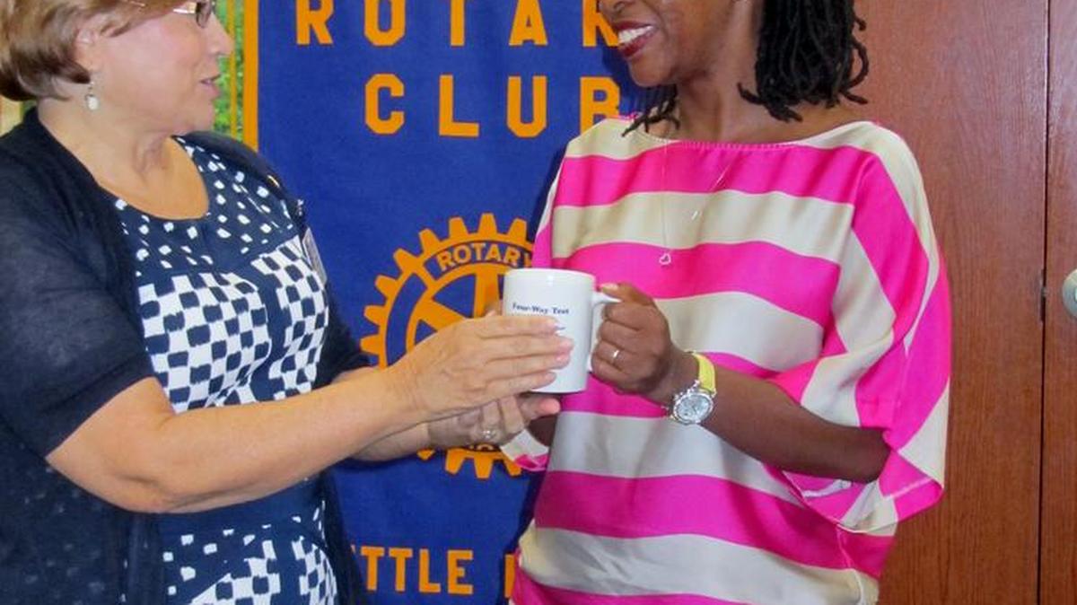 
Kathy Toavs, president of Rotary Club of Little River gives Tracy Swinton Bailey, founder of Freedom Readers, an official mug from the award-winning Rotary Club of Little River.

