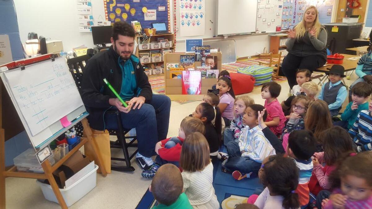 Coastal Carolina University student-athletes with kindergartners during United Way’s Caring for Kindergartners program.