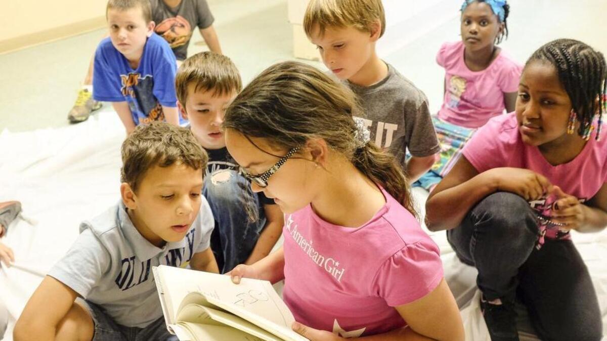 
Elizabeth Usher, 9, reads out loud to other children at the Burgess Community Center. Dollar General awarded the Horry County Literacy Council a Youth Literacy Grant to Annette Staehle earlier this year. She runs a “Read and Create,” for the children at the Burgess Community Center and St. Michael Catholic School. The Horry County Literacy Council to will have monthly orientations, 3-4 p.m. on the third Wednesday monthly (Aug. 19, Sept. 16 and Oct. 21) at the Goodwill Job Link Center, 2148 Oakheart Road, Carolina Forest.
