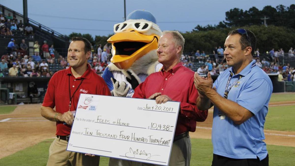 From left to right, are Jason Hayes (Better Brands VP), Splash (Pelicans Mascot), Kelly Lewis (Better Brands Sales Manager), and Andy Milovich (Pelicans President and GM).