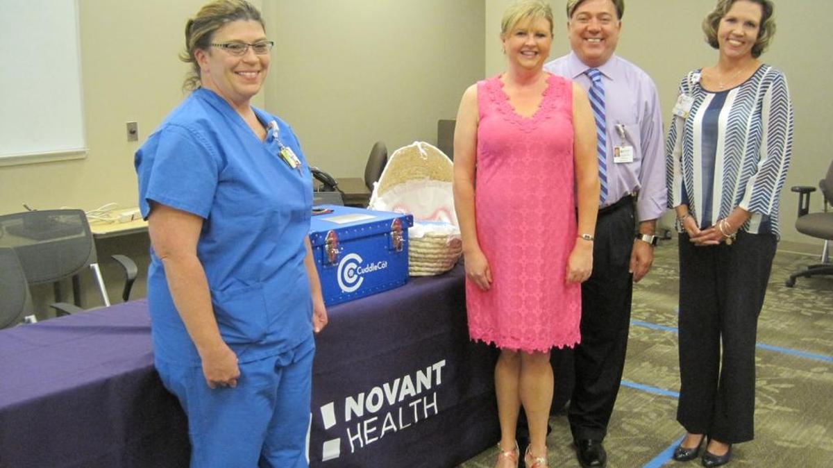 Left to right: Shannon Brown, RN, women’s services; Robin Hicken; Shelbourn Stevens, president, Novant Health Brunswick Medical Center; Beth Hicks, nurse manager, women’s services.