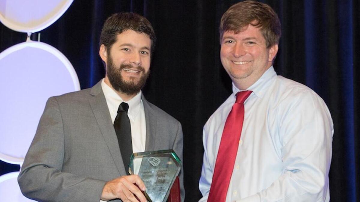 Neighbor to Neighbor Director Joe Kunkel received the award from Derek Lewis, a South Carolina Association of Nonprofit Organizations board member.