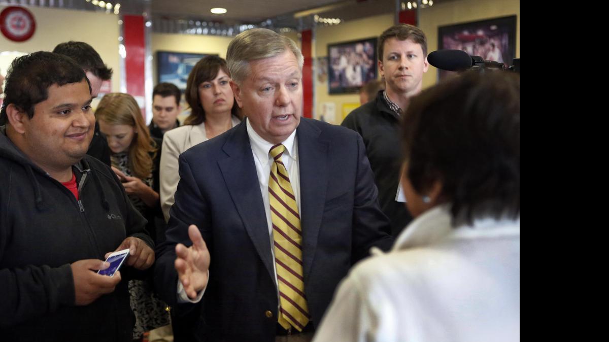 
Republican presidential candidate, Sen. Lindsey Graham, R-S.C., talks to customers during a campaign stop at MaryAnn's Diner, Tuesday, June 2, 2015, in Derry, N.H. 
