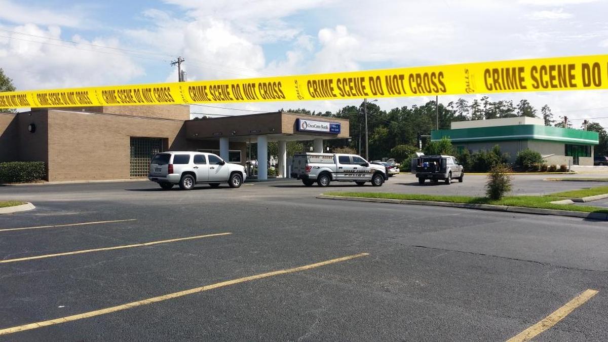 Crime scene tape surrounds the CresCom Bank in Conway where police responded to a reported armed robbery on Monday, Aug. 21, 2017.