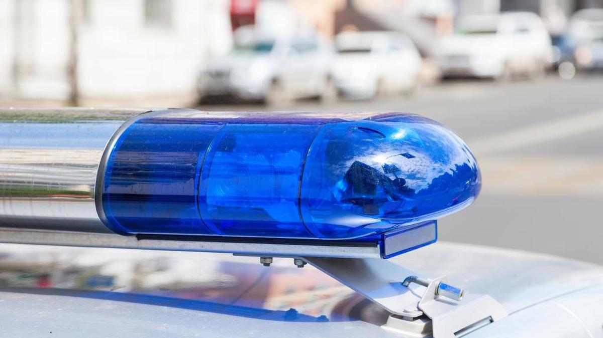 A disturbance at a funeral home Saturday sent one man to the hospital and one woman to jail.