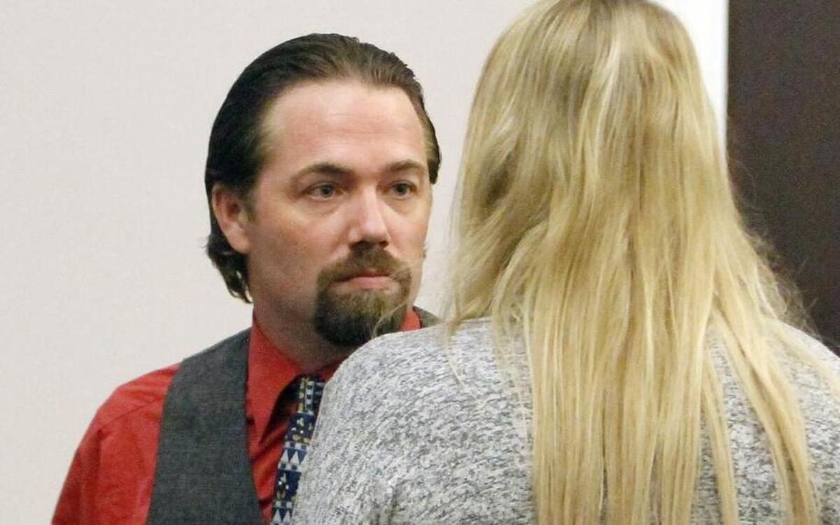 
Sidney Moorer talks to his wife Tammy Moorer as they prepare to leave the courtroom in a bond modification hearing in Charleston on Thursday, Aug. 6, 2015. The couple was allowed to travel to Orlando, Fla., for a week while Sidney Moorer interviewed for a job in his field of restaurant maintenance. The ruling stated if he gets a job that requires him to travel to different chain restaurants the jobs must be limited to South Carolina, North Carolina and Georgia. The Moorers are charged with the murder of Heather Elvis. She was reported missing on Dec. 19, 2013, after her car was found at Peachtree boat landing. Her body has not been found. The couple was charged in February 2014. A trial date has not been set.

