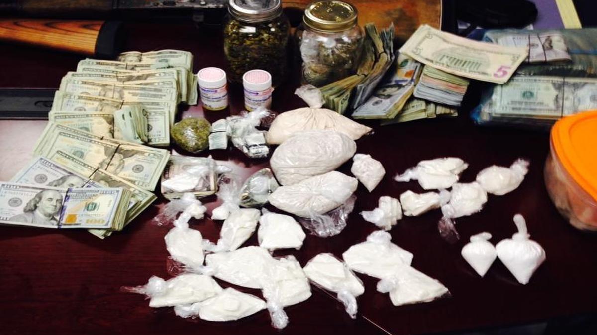 In all, officers seized 572 grams of heroin, 441 grams of crack, 35 grams of cocaine, a quantity of marijuana, six firearms – three of which were assault rifles and $81,887 in cash.