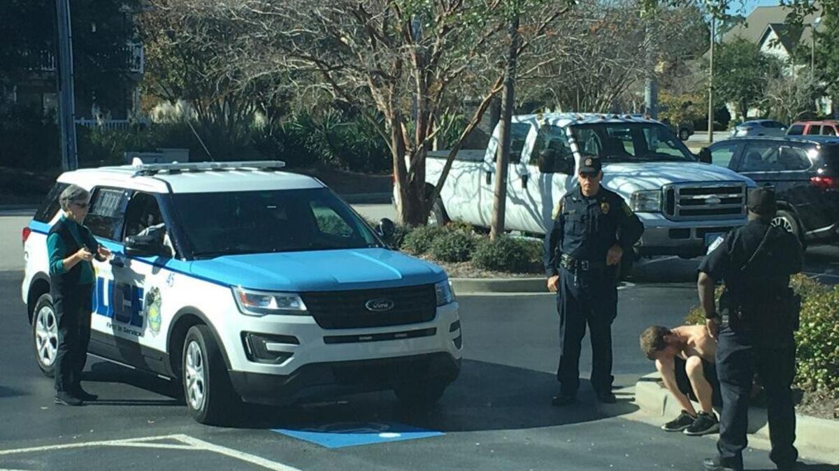 Myrtle Beach police detain a home burglary suspect along 48th Avenue North.