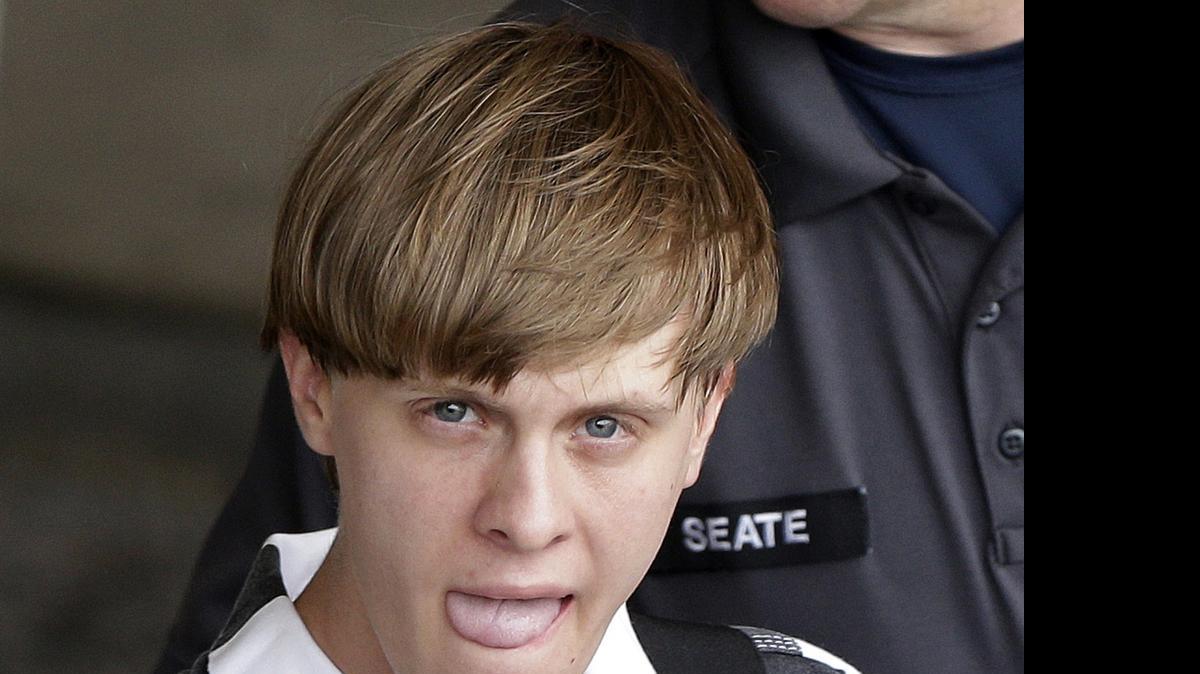 
FILE -In this Thursday, June 18, 2015 file photo, Charleston, S.C., shooting suspect Dylann Storm Roof is escorted from the Cleveland County Courthouse in Shelby, N.C. Roof is accused of killing nine people inside Emanuel African Methodist Episcopal Church in Charleston on June 17. 

