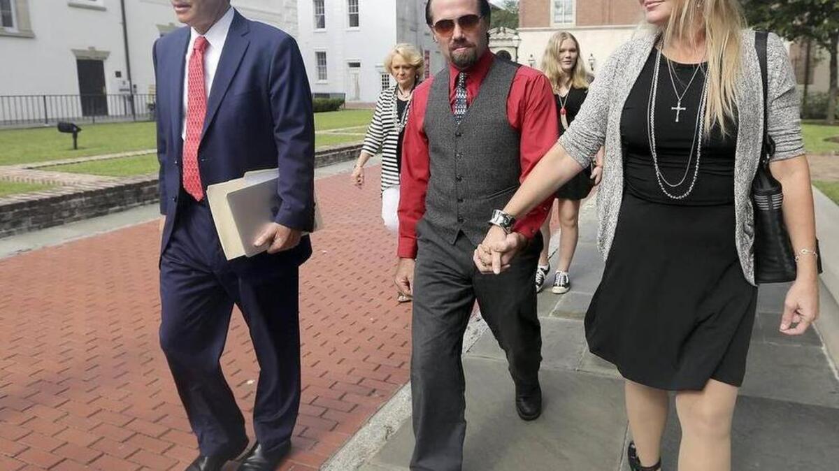 
Sidney and Tammy Moorer leave the courthouse in Charleston after a bond modification hearing on Thursday, Aug. 6. The couple has been allowed to travel to Orlando, Fla., for a week while Sydney Moorer is interviewing for a job in his field of restaurant maintenance. Now Sidney Moorer may have another bond modification hearing. 

