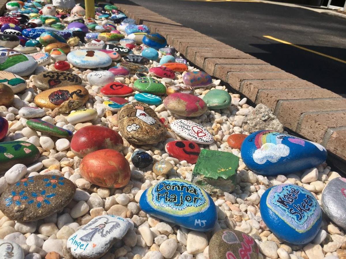 The rocks community members have painted to honor Kathryn Skeen and Donna Major. The rocks are on site at the CresCom Bank in Conway.