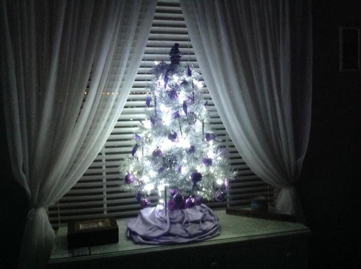 Michele Gagne, one of Frances “Mae” Davis’ daughters, put up a small Christmas tree decked with purple ornaments in her mother’s room to honor her.