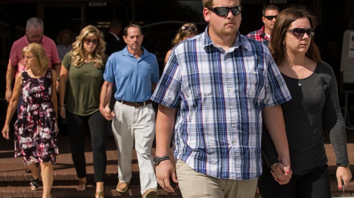 Family and friends of two women killed in a Conway bank robbery leave the John L. McMillan Federal Building in Florence, S.C. Brandon Michael Council, 32, of Wilson, N.C., was arraigned on federal charges for a Conway bank robbery last month that left two women dead.