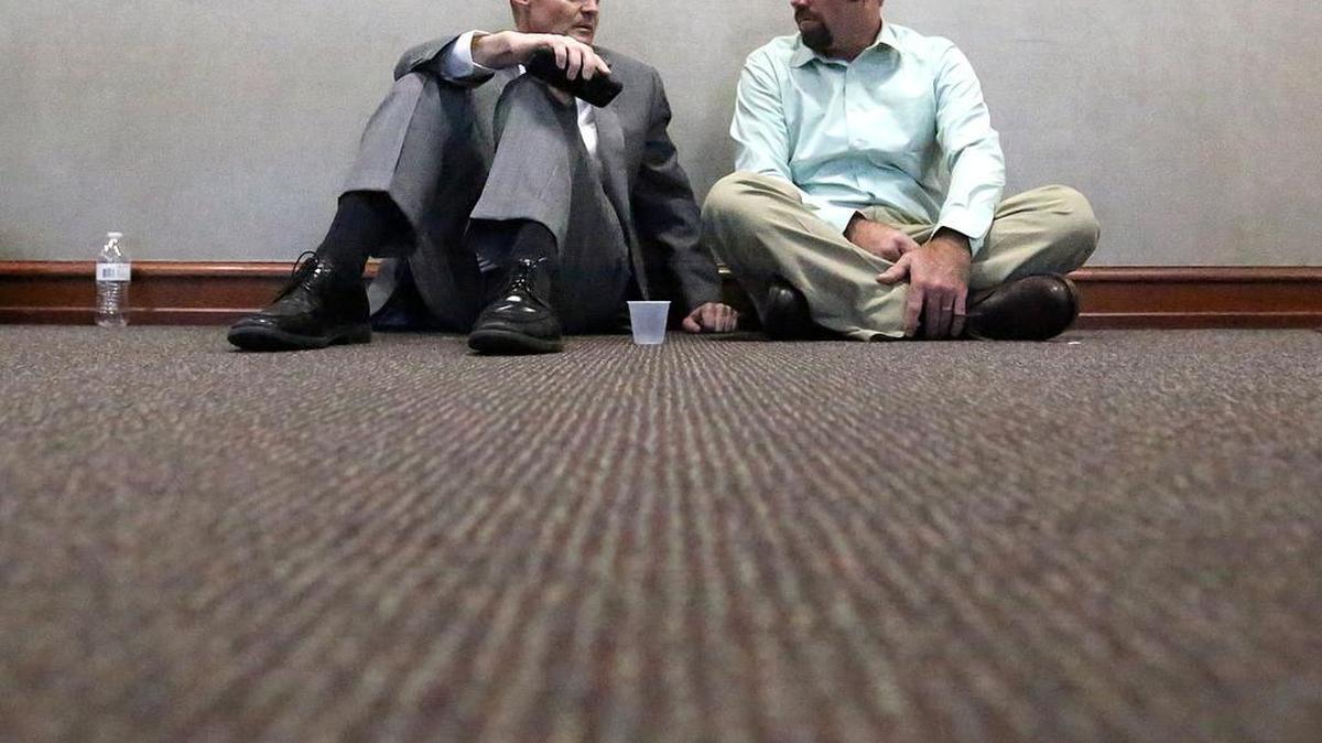 In the hallway, defense attorney Kirk Truslow (left) and Sidney Moorer wait for the jury in Moorer's kidnapping case on Friday, June 24, 2016. The jury announced around 3 p.m. they were deadlocked, but the judge asked them to keep deliberating. Moorer and his wife Tammy Moorer are charged with kidnapping Heather Elvis. No date has been set for Tammy Moorer's trial.
