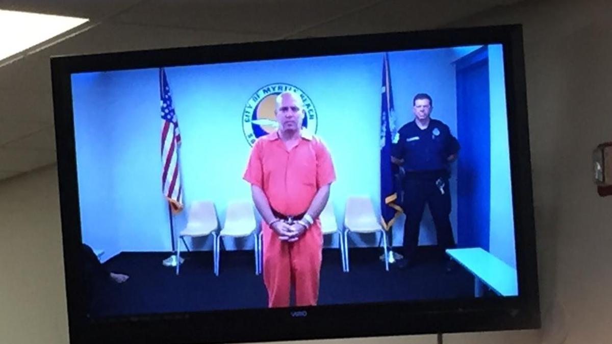 Shai David, 43, appears before a judge to await bond Wednesday afternoon.