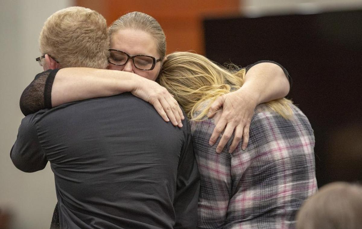 Tammy Moorer hugs her children Tuesday after receiving a sentence of 30 years in prison. Moorer was found guilty of kidnapping and conspiracy related to the 2013 disappearance of Heather Elvis.