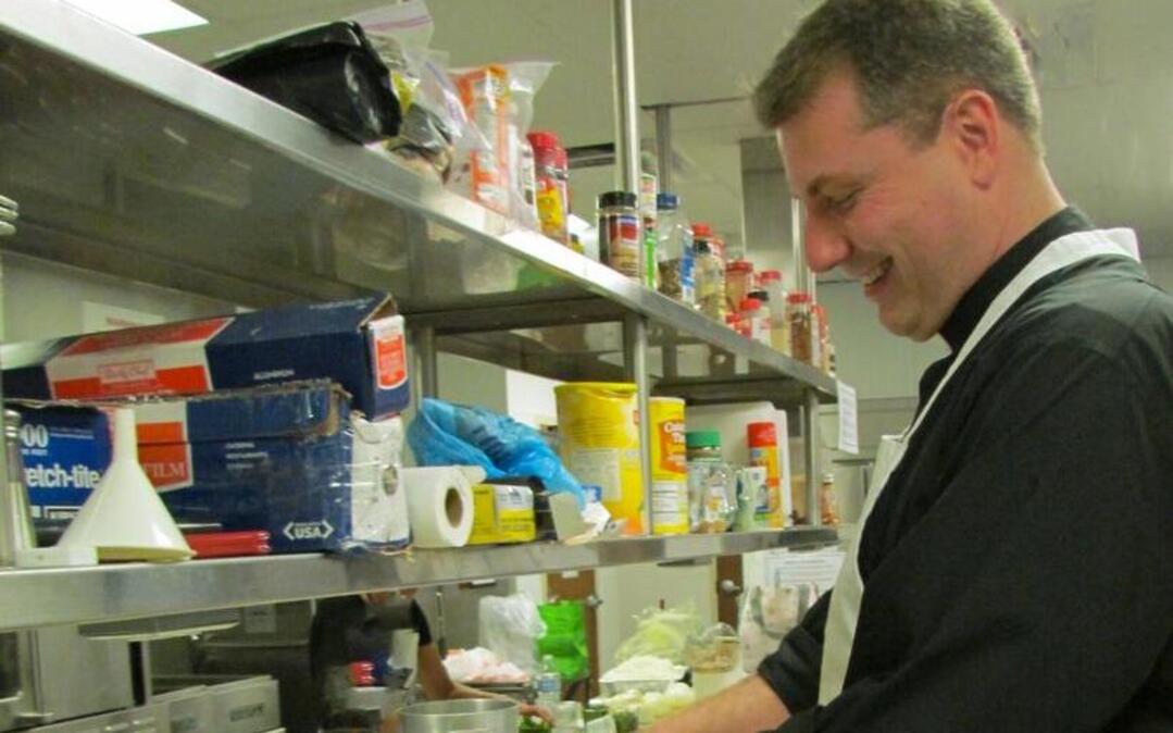 
The Rev. Roger Morgan, Parochial Vicar at Our Lady Star of the Sea Catholic Church in North Myrtle Beach, helps separate cabbage leaves in the church’s kitchen. The Ladies Guild will sell frozen cabbage rolls at the Craft Fair in November. 
