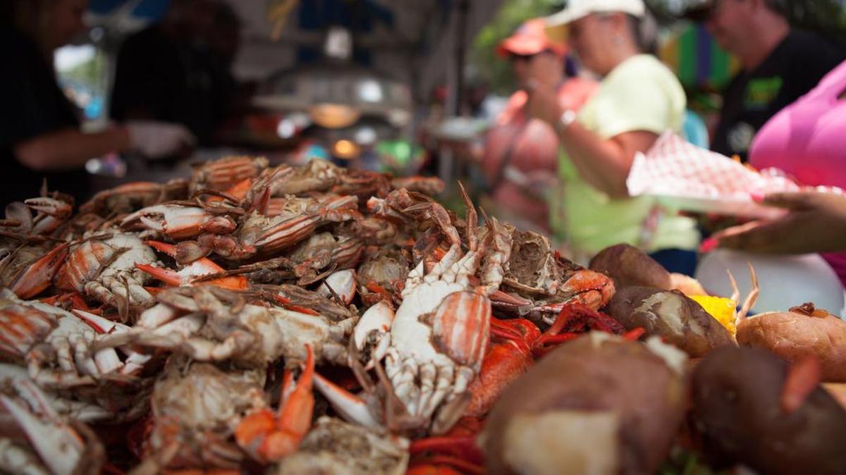 Cooked crabs lie in a steaming heap in time for lunch during the 2015 Little River Blue Crab Festival. Festival-goers crowd the narrow streets of the waterfront with people from around the region looking for some great food, live music and a huge selection of vendors.