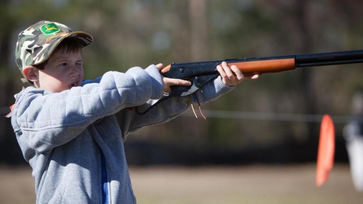 Six year old Holden Coker fires a BB gun. Juniper Bay Baptist Church in Conway hosts its eighth annual Wildlife Expo Saturday, March 4, 2017.