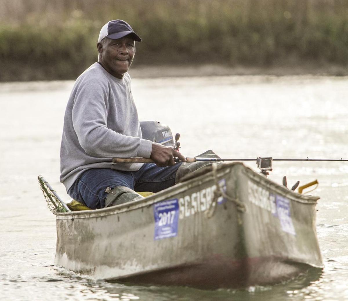 Franklin Smalls, aka ‘Snakeman’, piloting his motorized canoe through the creeks of Murrells Inlet, S.C. was a familiar sight to locals. TSN File Photo 2017.