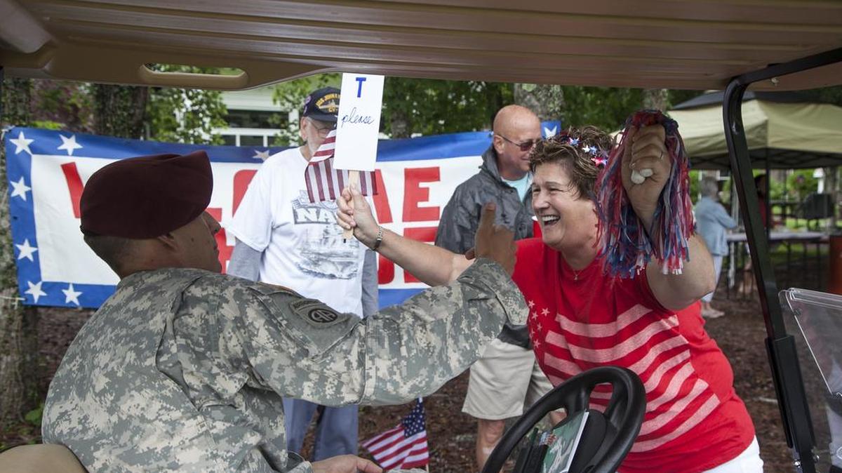 Veterans were met by a grateful group of community residents at the 16th green of the Long Bay Club during the 2017 Veterans Golf Classic. Community members provided hats, golf towels, hotdogs, baked goods and beverages as they thanked 120 golfers for their military service on Wednesday, June 7, 2017.