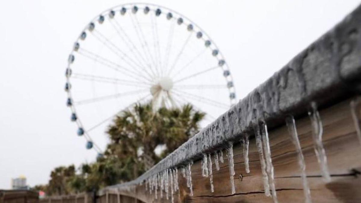 Freezing rain and snow moved up the Grand Strand Wednesday, causing numerous car wrecks across the region and shutting down schools.