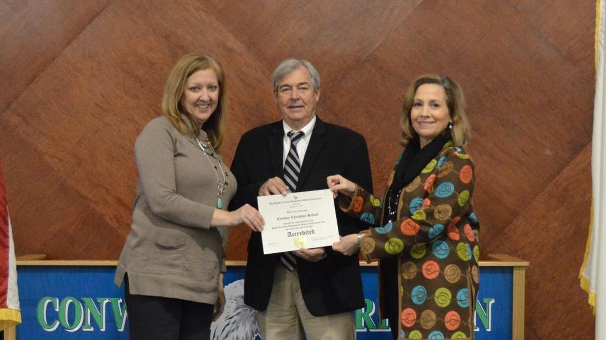 Laura Hogue, academic dean, Larry Watt, executive director of SCISA, and Connie Smith, principal, celebrate Conway Christian’s accreditation.