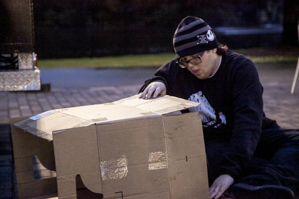 Xavier Jackson constructs a shelter from a cardboard box at Coastal Carolin University. CCU students plan to camp out overnight on the Prince Lawn in cardboard boxes to raise awareness of the homeless. Thursday, November 9, 2017.