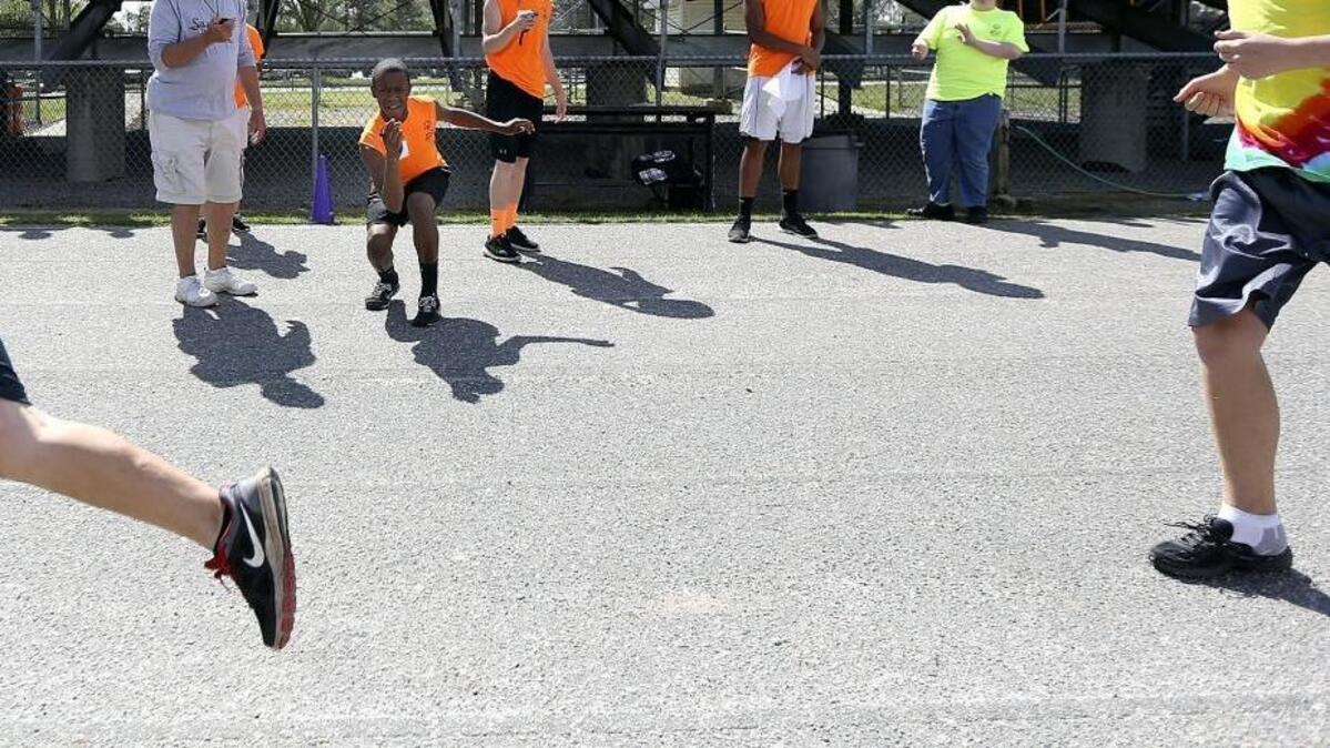 
Student volunteers keep the events moving and time tracked during the Horry County Special Olympic Spring Games at Socastee High School on Friday, April 4, 2014. 
