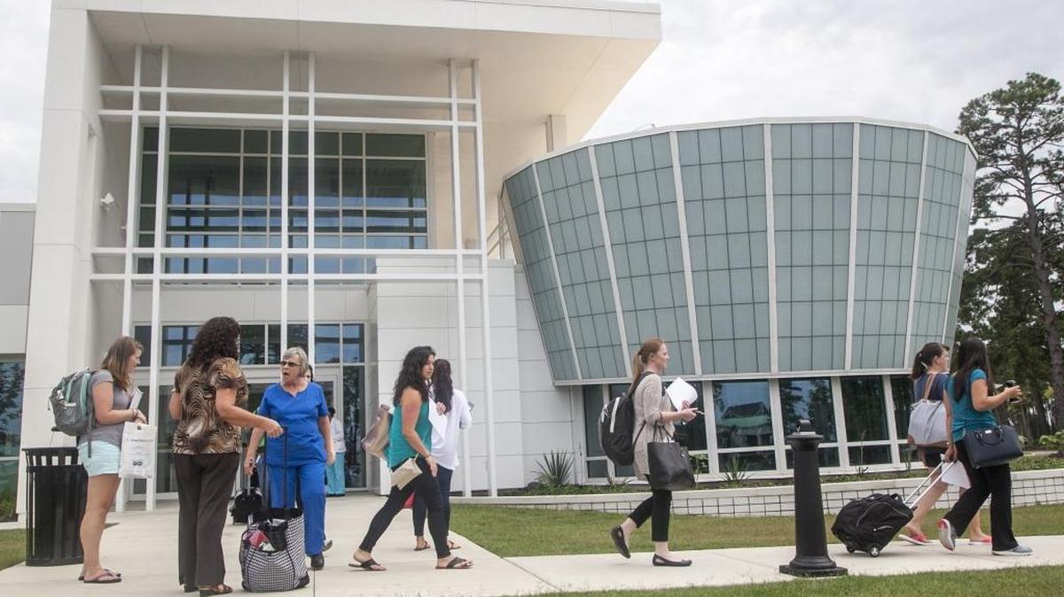 Pedestrians walk by HGTC's International Culinary Institute of Myrtle Beach.